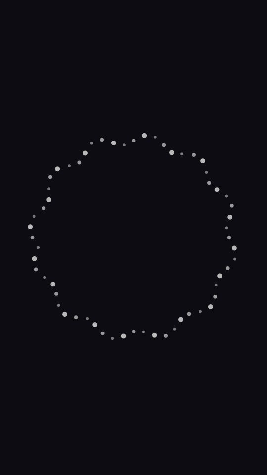 Ring of small grey dots forming a circle on near-black.